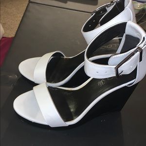 White wedges with black heel
